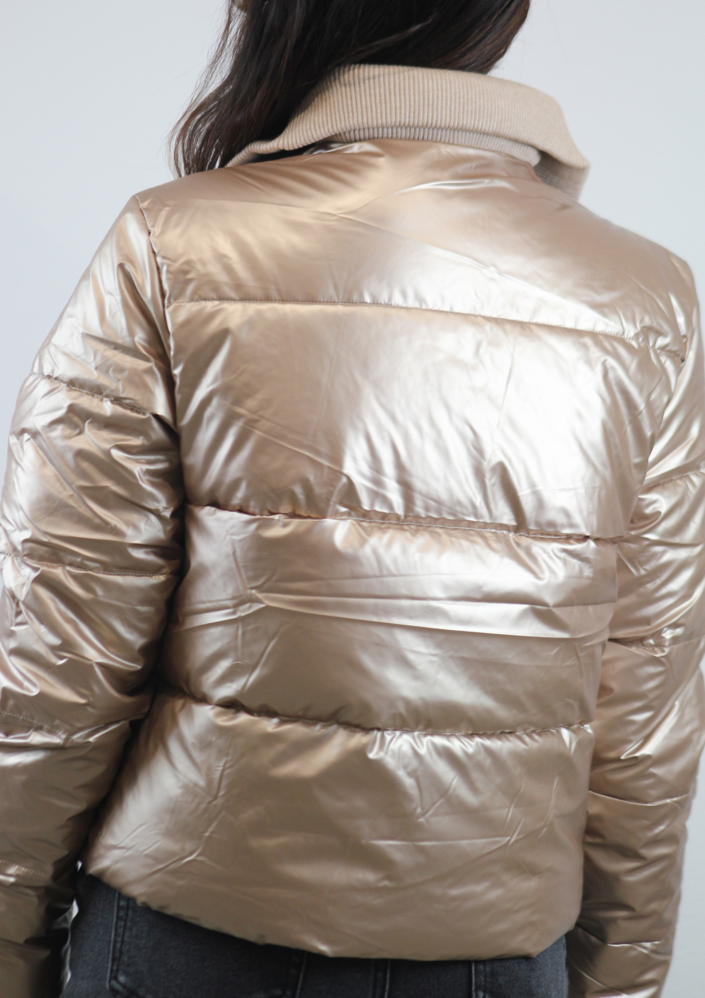 Piumino collo maglia beige